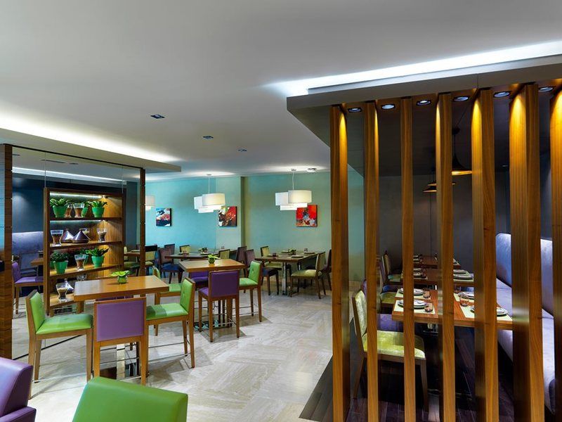 Damac Maison The Vogue Dubai Exterior photo The interior of a restaurant in the hotel