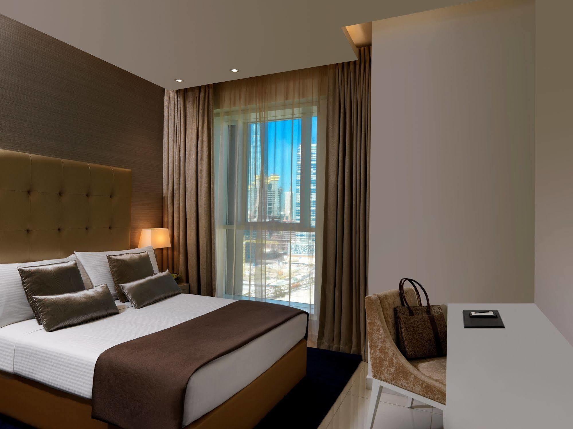 Damac Maison The Vogue Dubai Exterior photo A bedroom at the hotel